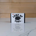 Lump of Coal charcoal soap by PoCo Soap Co. in black and white packaging. The perfect holiday stocking stuffer made with activated charcoal and skin-nourishing shea butter.