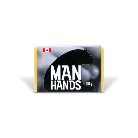 Man Hands heavy-duty exfoliating soap by PoCo Soap Co. in black and white packaging. Features high-grit ground pumice and 100% natural Tangerine essential oil.